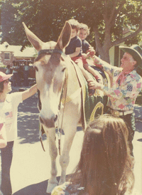 Stanley Cosca at a parade Charlie O the Mule in Oakland, Skyline Ranch home of the Oakland A's Baseball team mascot Mule